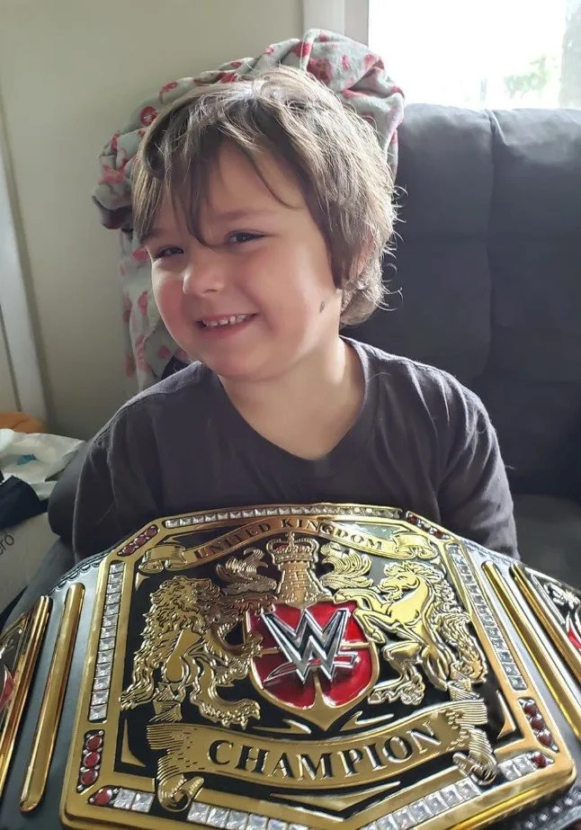 Timmy Vick, a 5-year-old autistic boy from Delaware, likes to sleep with his replica WWE belt at night. (Credit: Sergio Moreira)