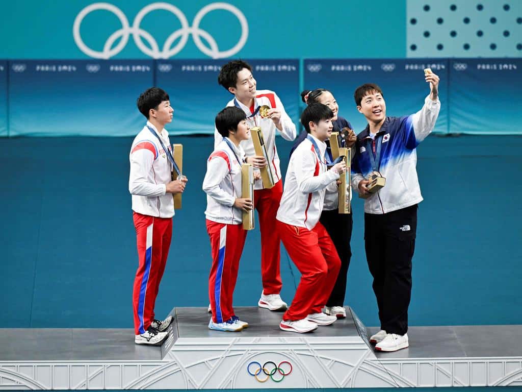 Athletes from North and South Korea have perfectly summed up what the Olympics are all about, posing for a selfie together on the podium in a rare display of unity between the two nations.