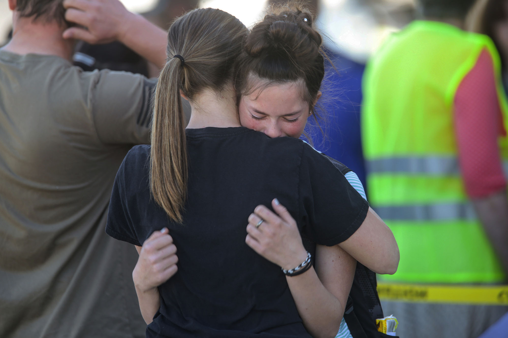 Students embrace after a school shooting at Rigby Middle School in Rigby, Idaho 