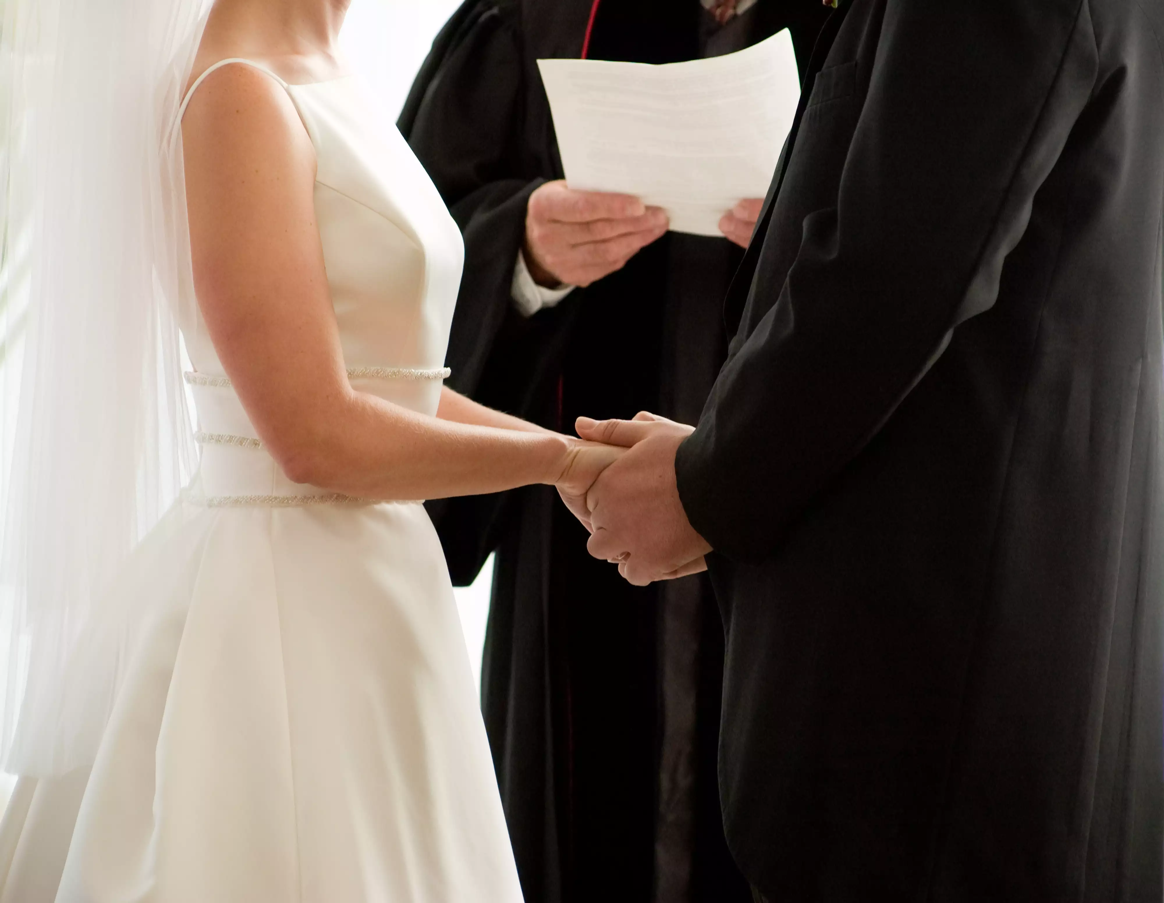 Wedding ceremony - stock file image. Couple got married in service station restroom