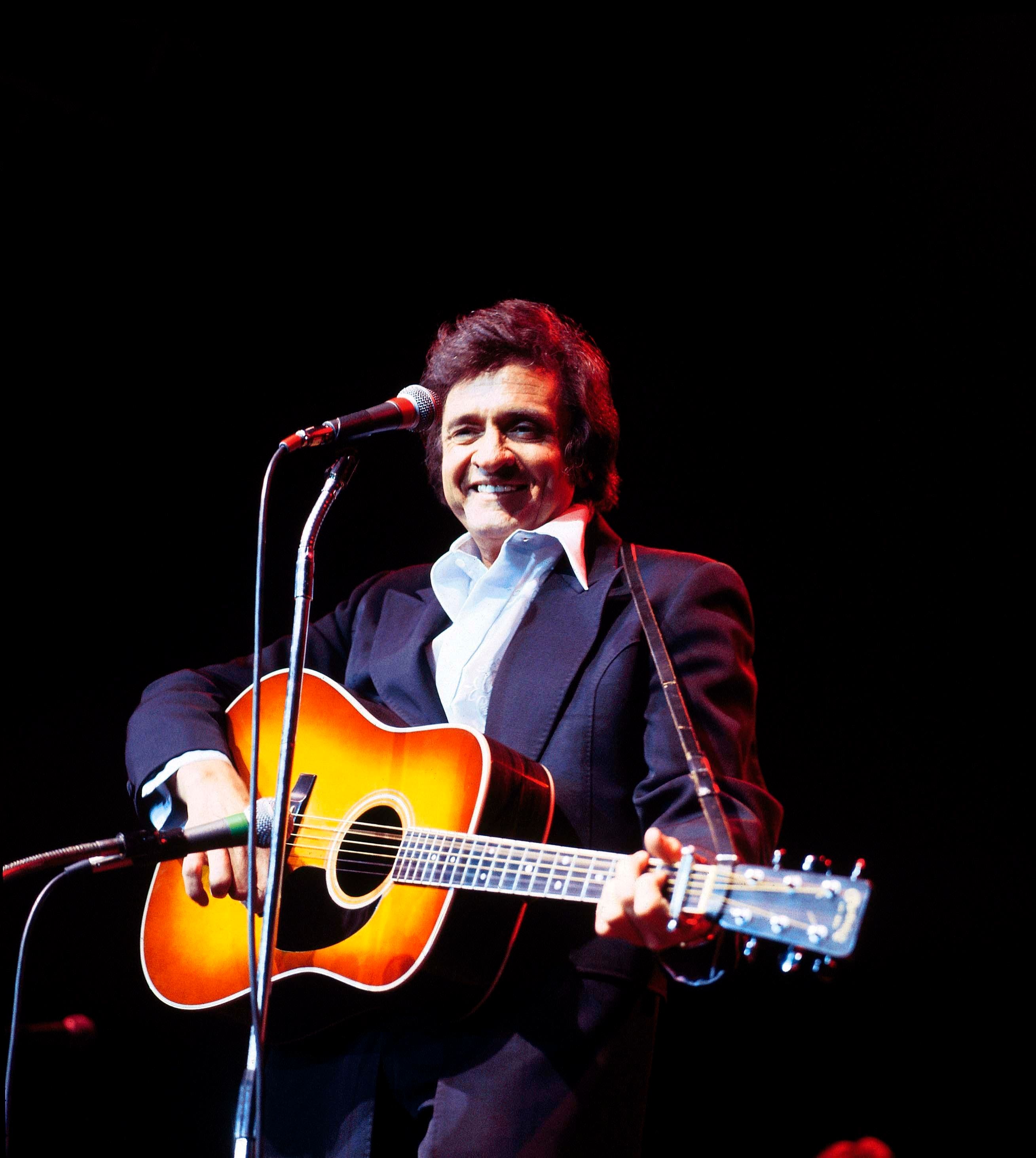 Johnny Cash performing on stage at Festival of Country Music, Wembley Arena.